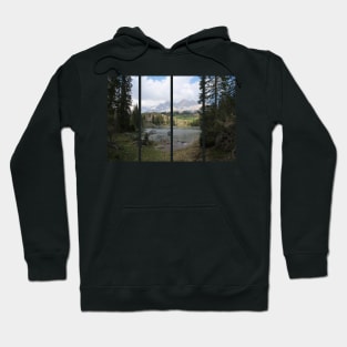 The fabulous alpine lake of Carezza in the Dolomites (Bolzano). Lovely place in the Italian Alps. Reflections in the water. View from the shore. Sunny spring day. Trentino Alto Adige Hoodie